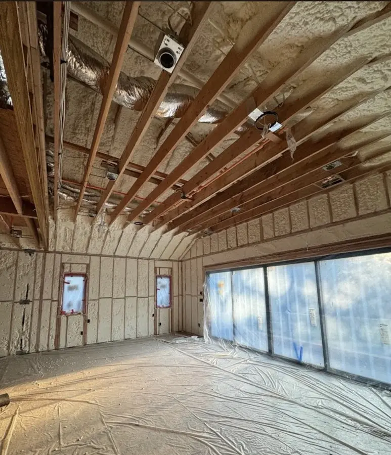 Interior walls and ceiling insulated with spray foam during new construction in West Puente Valley